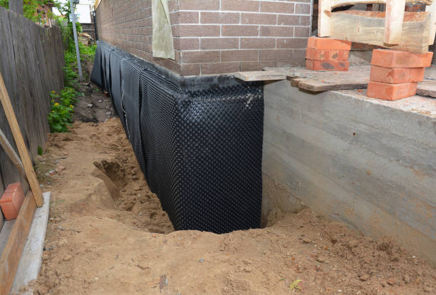 Happy homeowners after waterproofing job in Ixonia